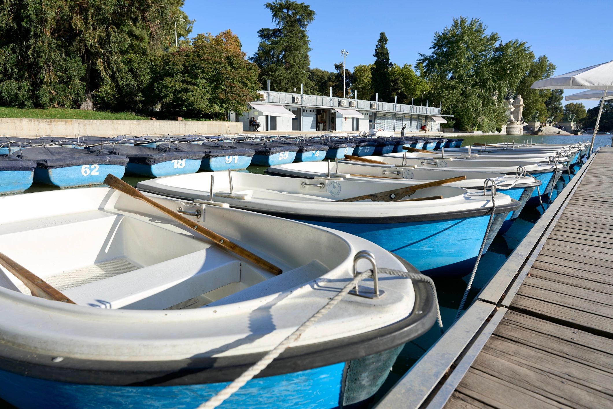 Boats docked at a pier on a sunny day